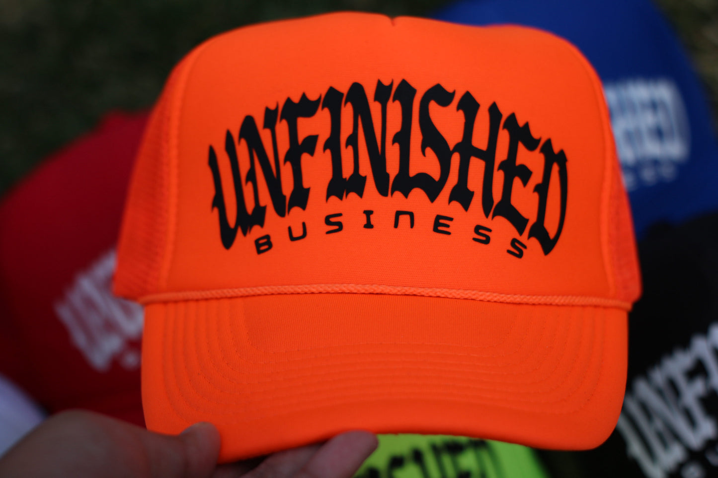 Unfinished Business Trucker Hat (Safety Orange)